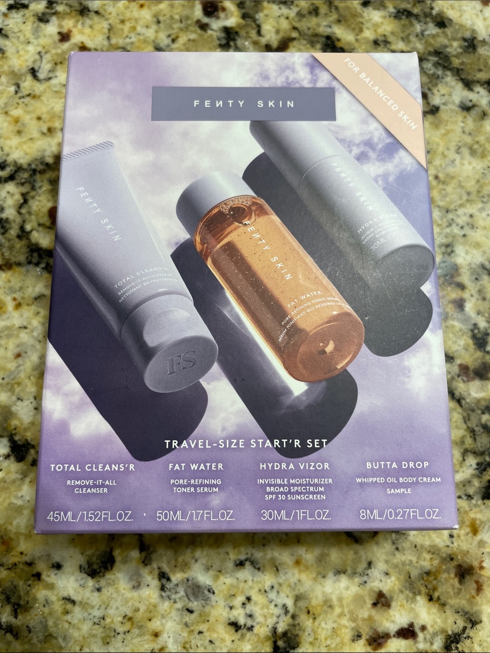 Fenty Beauty Travel-Size Skincare Set — Purple & Orange Bottles